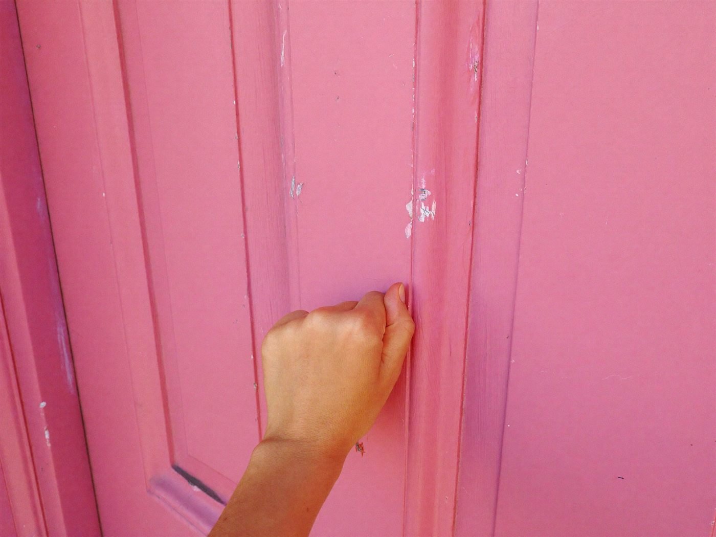 Knocking a pink door